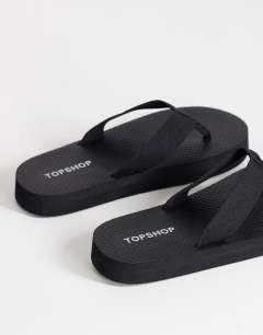 Model wearing Molly toe thong sandal in black