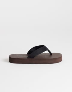 Model wearing Molly toe thong sandal in chocolate