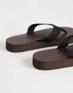 Model wearing Molly toe thong sandal in chocolate
