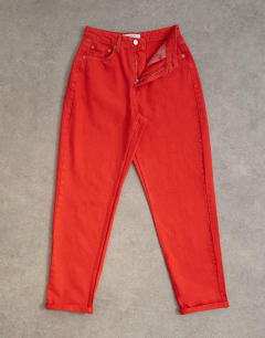 Model wearing Mom high rise loose fit jean in red