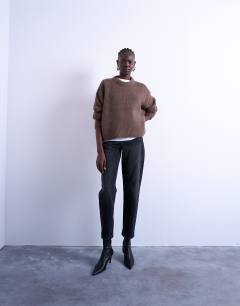 Model wearing Mom jeans in washed black