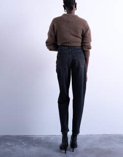 Model wearing Mom jeans in washed black