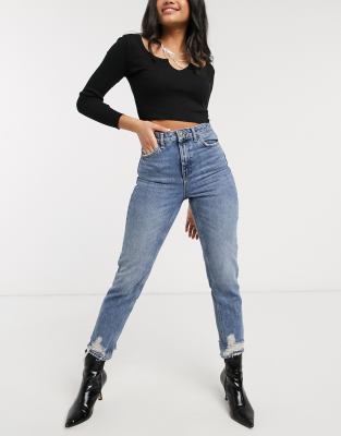 mid blue ripped mom tapered jeans