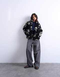 Model wearing Mono floral print fleece borg jacket in rose