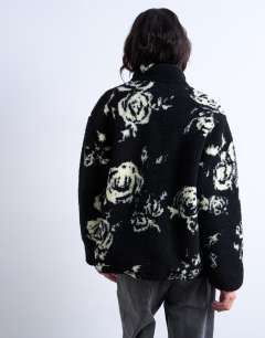 Model wearing Mono floral print fleece borg jacket in rose