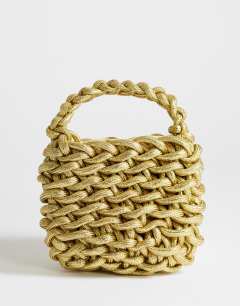 Model wearing Morgan small weave grab bag in gold