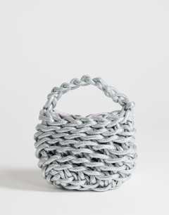 Model wearing Morgan small weave grab bag in silver