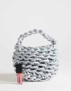 Model wearing Morgan small weave grab bag in silver