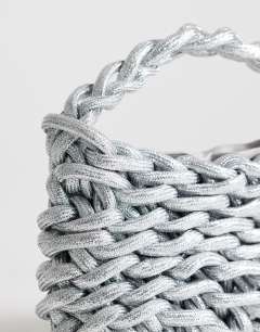 Model wearing Morgan small weave grab bag in silver