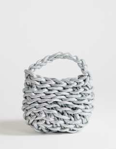 Model wearing Morgan small weave grab bag in silver