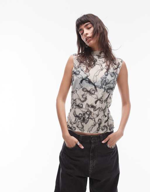 Topshop - Mouwloze top van kreukelstof met strikjesprint in zwart-wit