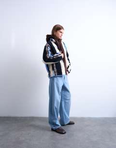 Model wearing Multi stripe borg fleece jacket in white stripe