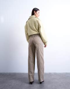 Model wearing Multi stripe cinch trouser in brown