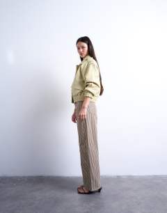 Model wearing Multi stripe cinch trouser in brown