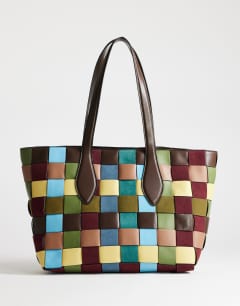 Model wearing Myla large patchwork tote in blue