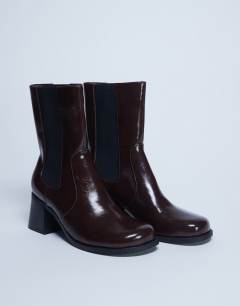 Model wearing Myra block heel chelsea boot in chocolate