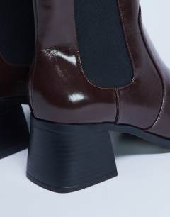 Model wearing Myra block heel chelsea boot in chocolate