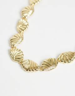 Model wearing Naleigh swirl necklace in gold