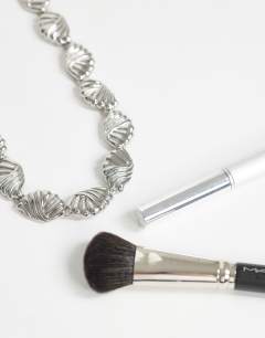 Model wearing Naleigh swirl necklace in silver