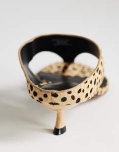 Model wearing Nancy toe thong mid heel sandal in caramel dalmatian print hair on real leather 