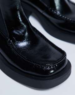 Model wearing Narla square toe chelsea boot in black