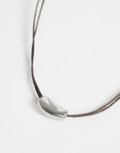 Model wearing Nasha cord necklace in chocolate with silver