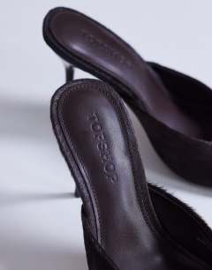Model wearing Nasim high heeled mule in chocolate hair on real leather