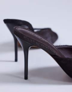 Model wearing Nasim high heeled mule in chocolate hair on real leather