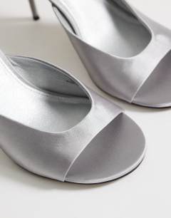 Model wearing Nasim high heeled mule in grey satin