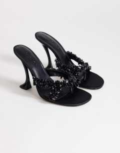 Model wearing Natasha embellished mule high heeled sandal in black