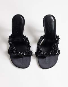 Model wearing Natasha embellished mule high heeled sandal in black