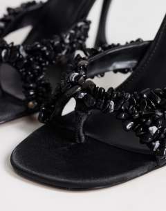 Model wearing Natasha embellished mule high heeled sandal in black