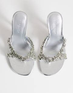 Model wearing Natasha embellished mule high heeled sandal in silver