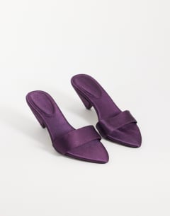 Model wearing Nathan cone heel mule in purple satin