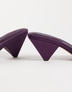 Model wearing Nathan cone heel mule in purple satin