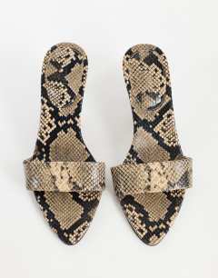 Model wearing Nathan cone heel mule in snake print