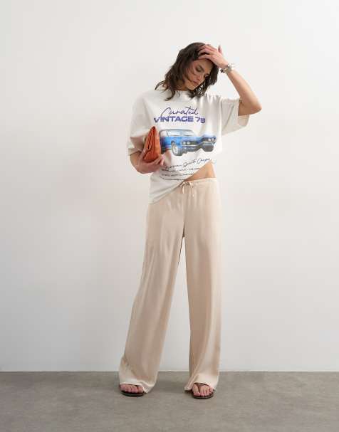 Topshop – Naturvita, vida byxor i satin med knytning i midjan - view 1