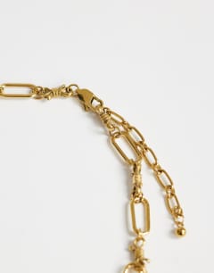 Model wearing Naya waterproof stainless steel chain necklace with charms in gold