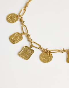 Model wearing Naya waterproof stainless steel chain necklace with charms in gold