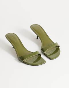 Model wearing Neptune kitten heel mule in olive green
