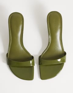 Model wearing Neptune kitten heel mule in olive green