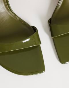 Model wearing Neptune kitten heel mule in olive green
