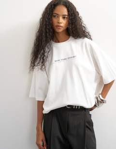 Model wearing Topshop 'New York Edition' graphic t-shirt in ecru