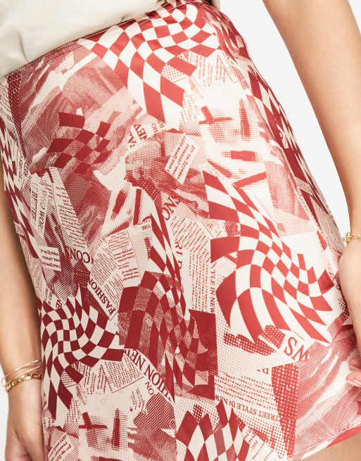 Topshop newspaper print mini bias skirt in red