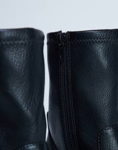 Model wearing Niamh block heel ankle boot in black