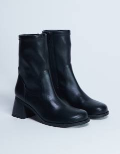 Model wearing Niamh block heel ankle boot in black