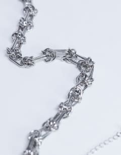 Model wearing Nicky waterproof stainless steel twisted chain necklace in silver