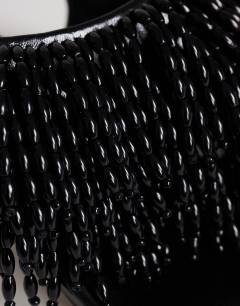Model wearing Night beaded toe thong heeled sandal in black