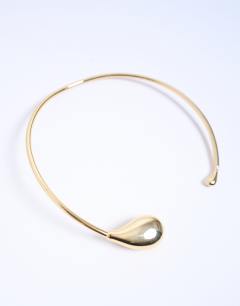 Model wearing Nila teardrop adjustable choker necklace in gold