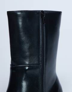 Model wearing Nina chunky heeled ankle boot in black
